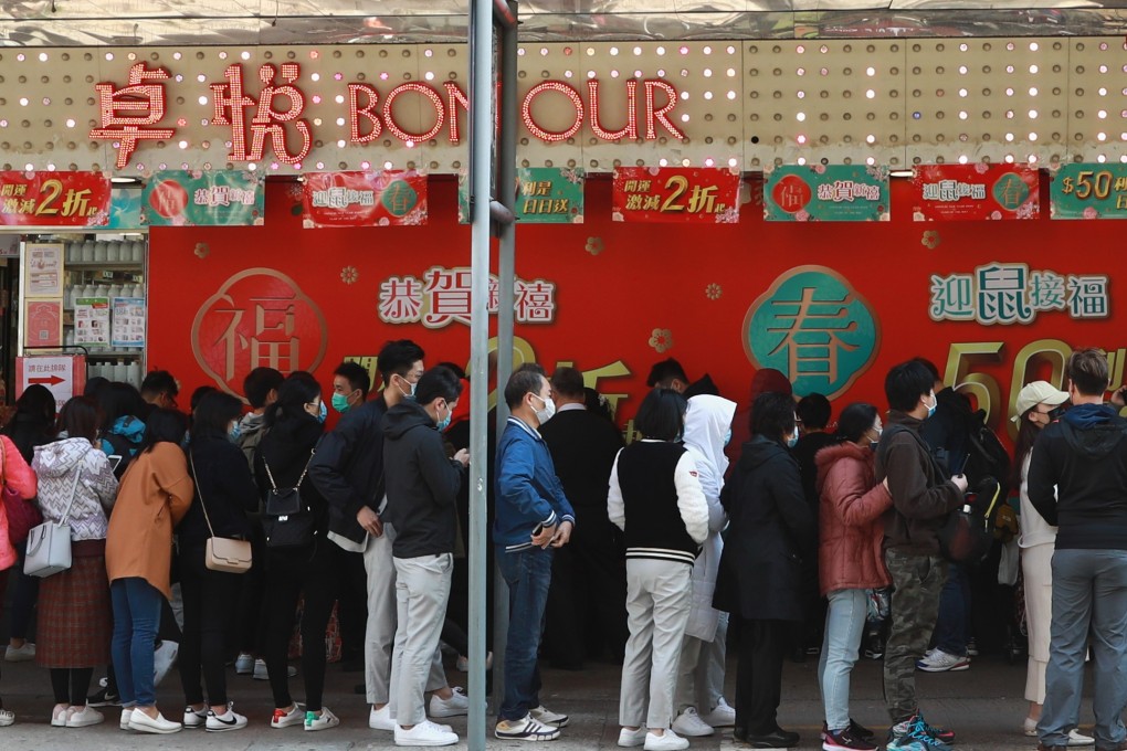 People queue for masks outside Bonjour shop in Mong Kok. The government has announced 32 million masks for public use are on the way. Photo: May Tse