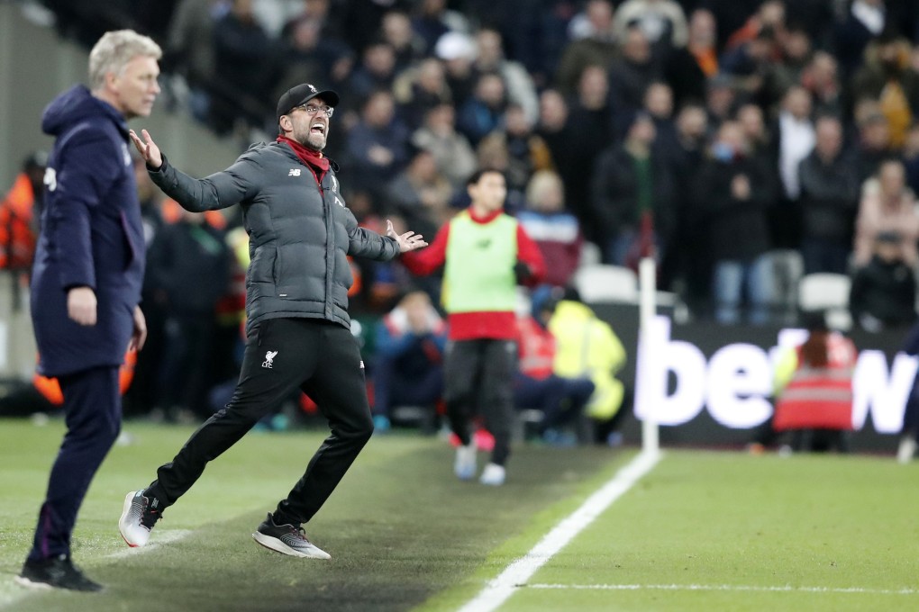 West Ham manager David Moyes (left) and Liverpool boss Jurgen Klopp react during the English Premier League match. Photo: AP