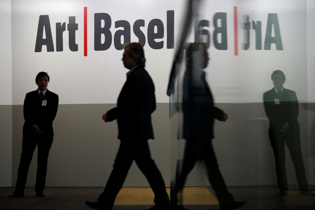 A guest attends a reception for Art Basel Hong Kong. Hong Kong art galleries have criticised counterparts overseas who have called on organisers to cancel the fair for misrepresenting the situation in Hong Kong. Photo: Reuters