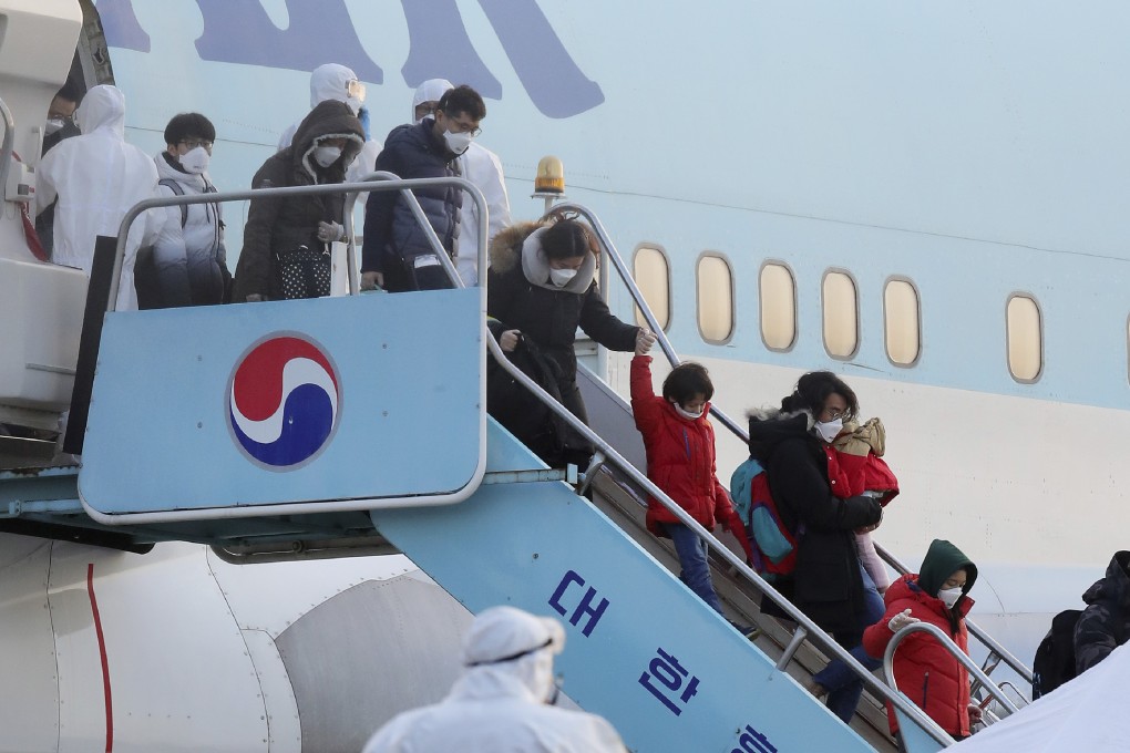 South Koreans evacuated from Wuhan disembark from a chartered flight in Seoul. Photo: AP