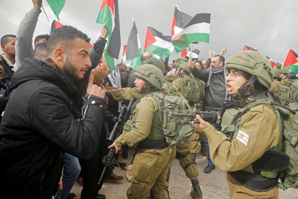 A Palestinian demonstrator argues with Israeli forces during a protest against the US President Donald Trump’s Middle East peace plan. Photo: Reuters