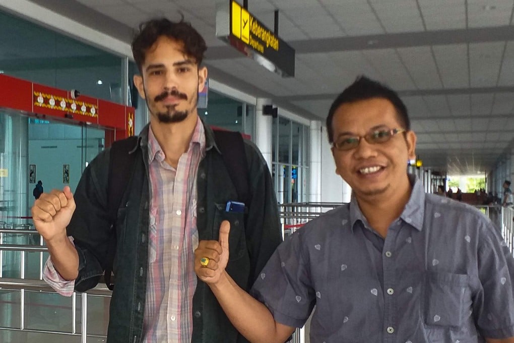 US journalist Philip Jacobson (L). Photo: AFP