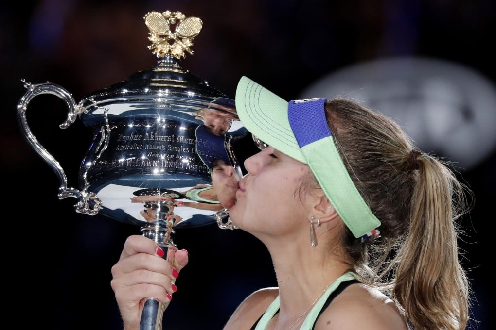 Sofia Kenin kisses the Daphne Akhurst Memorial Cup after defeating Spain's Garbine Muguruza in the women's singles final at the Australian Open. Photo: AP