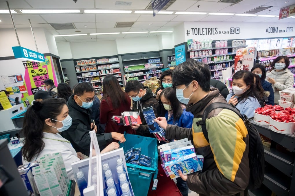 People scramble to buy protective masks at pharmacy in Hong Kong on January 29, amid fears of the Wuhan coronavirus spreading among the local population. Photo: Bloomberg