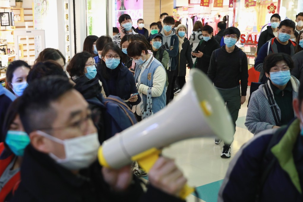People queue for masks at a store in Hong Kong’s Quarry Bay as fears over the coronavirus outbreak spread. Like viruses know no boundaries, fake news breeds panic and distrust. Photo: May Tse