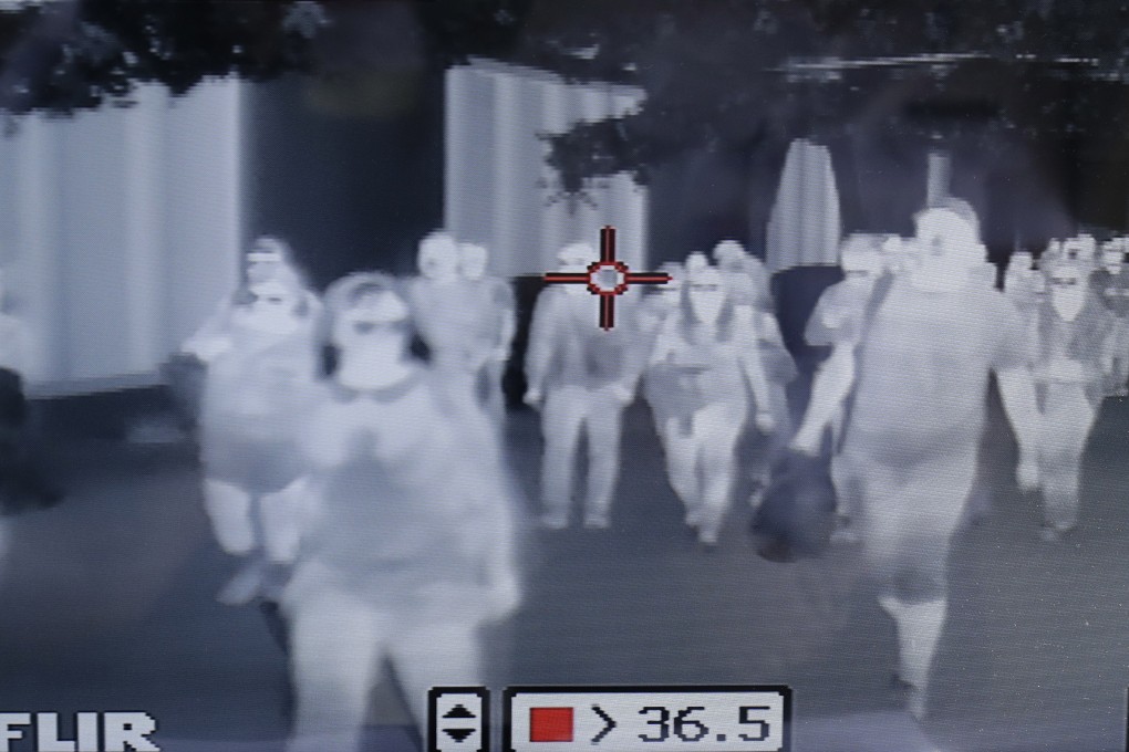 A thermal scanner checks on arriving passengers at Manila’s international airport in the Philippines. Photo: AP