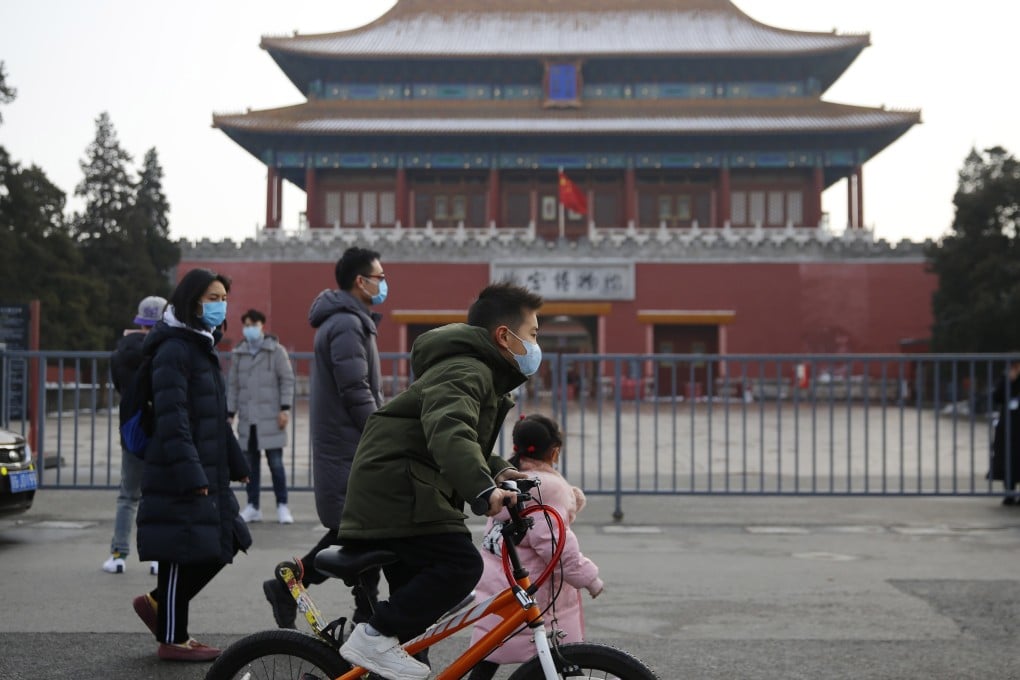 People wearing face masks in Beijing as China battles to control the coronavirus outbreak. Photo: EPA-EFE