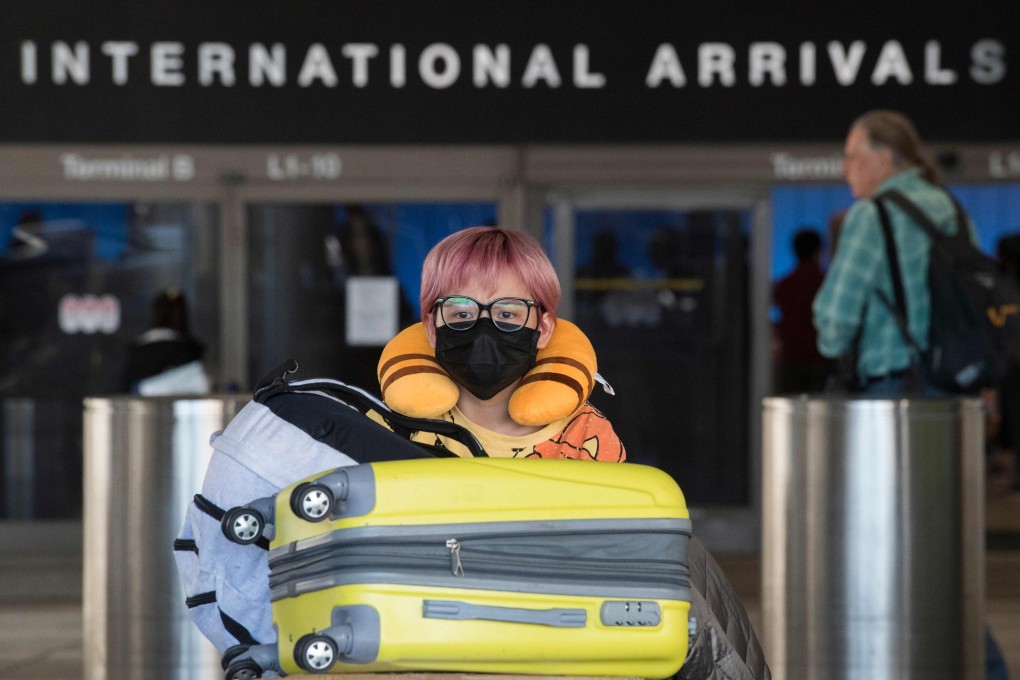Passengers wear face masks to protect against the spread of the coronavirus as they arrive on a flight from Asia, at Los Angeles International Airport. Photo: AFP