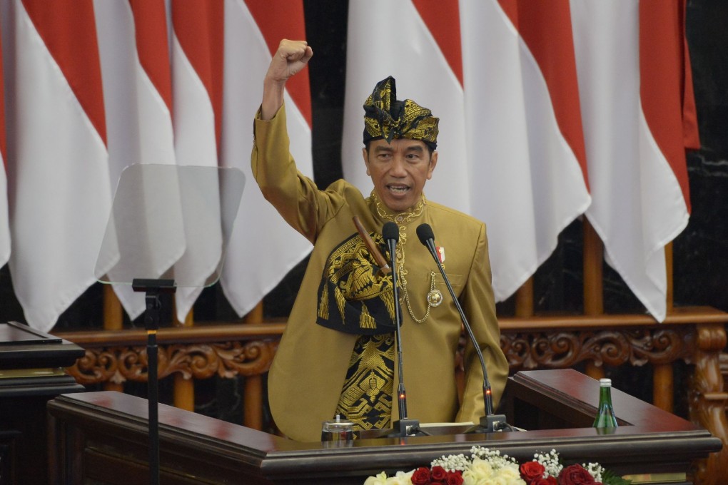 Indonesia’s President Joko Widodo delivers his state-of-the-nation address last August. He set the 75 per cent target for financial inclusion in 2016. Photo: AFP