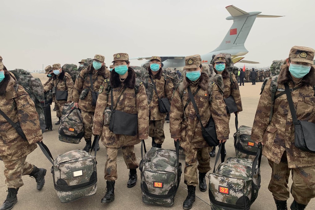 Military medical staff airlifted by the People's Liberation Army arrive at Tianhe International Airport in Wuhan, China. Photo: Xinhua