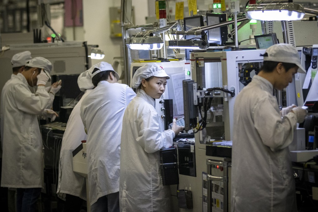 Employees are seen work at Huawei Technology’s factory in Dongguan, Guangdong province, on December 10, 2019. Photo EPA-EFE