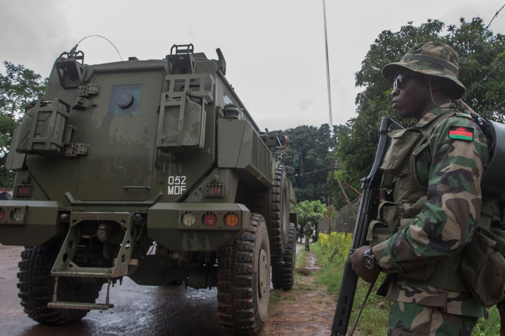 Heavy security by the Malawi defence force is present at the Lilongwe High Court, where constitutional court judges decided to annul May’s controversial presidential vote. Photo: AFP