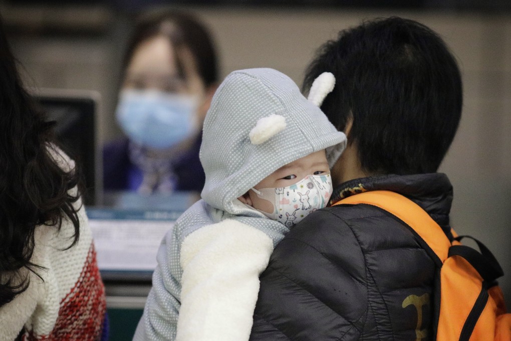 A child wears a protective mask at Guangzhou airport, Guangdong province, on January 23, 2020. Photo: EPA