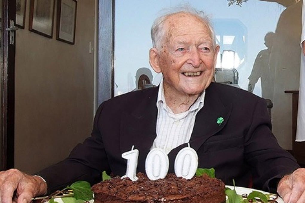 Mike Hoare, one of Africa's famous mercenaries, sitting in front of a birthday cake in 2019. Photo: AFP