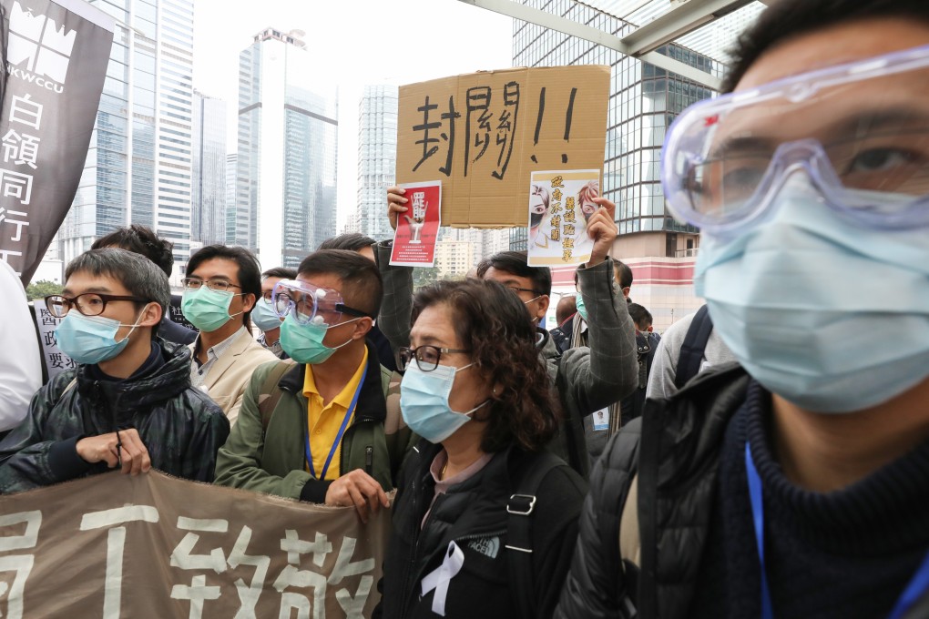 Hospital Authority workers raise protest slogans outside government headquarters. Photo: Nora Tam