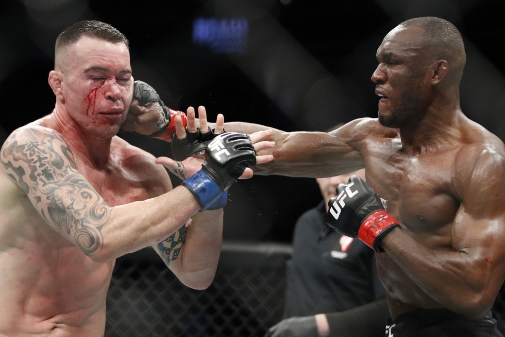 Kamaru Usman (right) hits Colby Covington in their welterweight championship fight at UFC 245 in December. Photo: AP