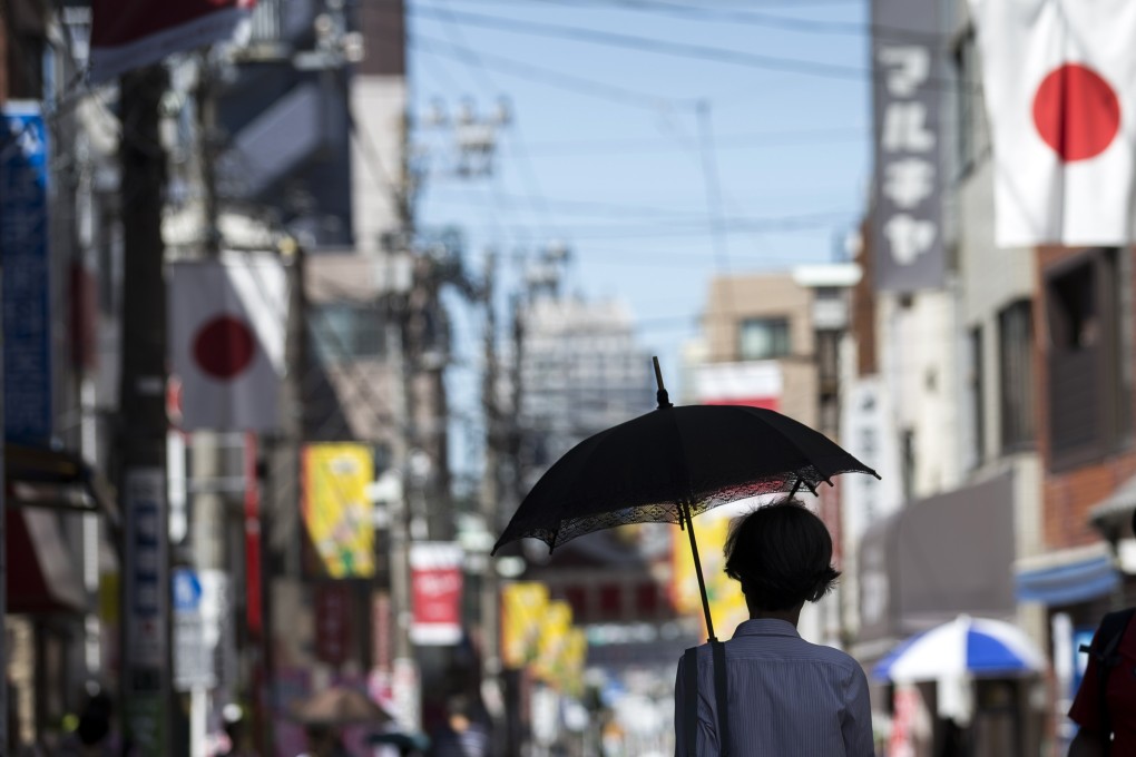 National flags in the Sugamo shopping district of Tokyo celebrate Respect for the Aged Day. Photo: Getty Images