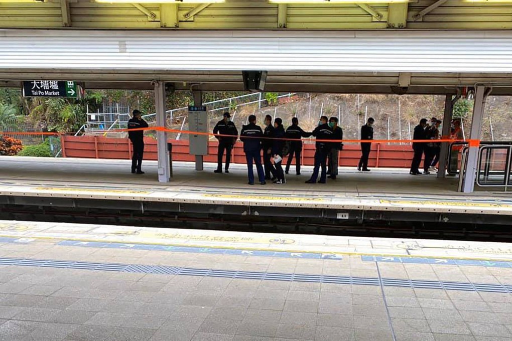 Police officers gather on a platform at Tai Po Market MTR station after a suspicious package was found nearby. Photo: Facebook