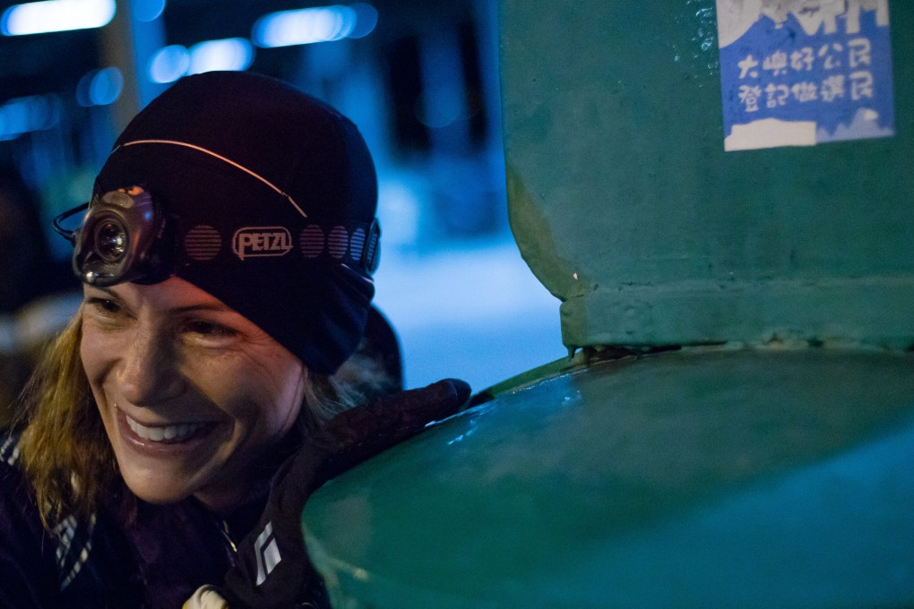 Virginie Goethals surviving the Hong Kong Four Trails Ultra Challenge. The next day, she was back on her feet handing out supplies to refugees. Photo: Alan Li