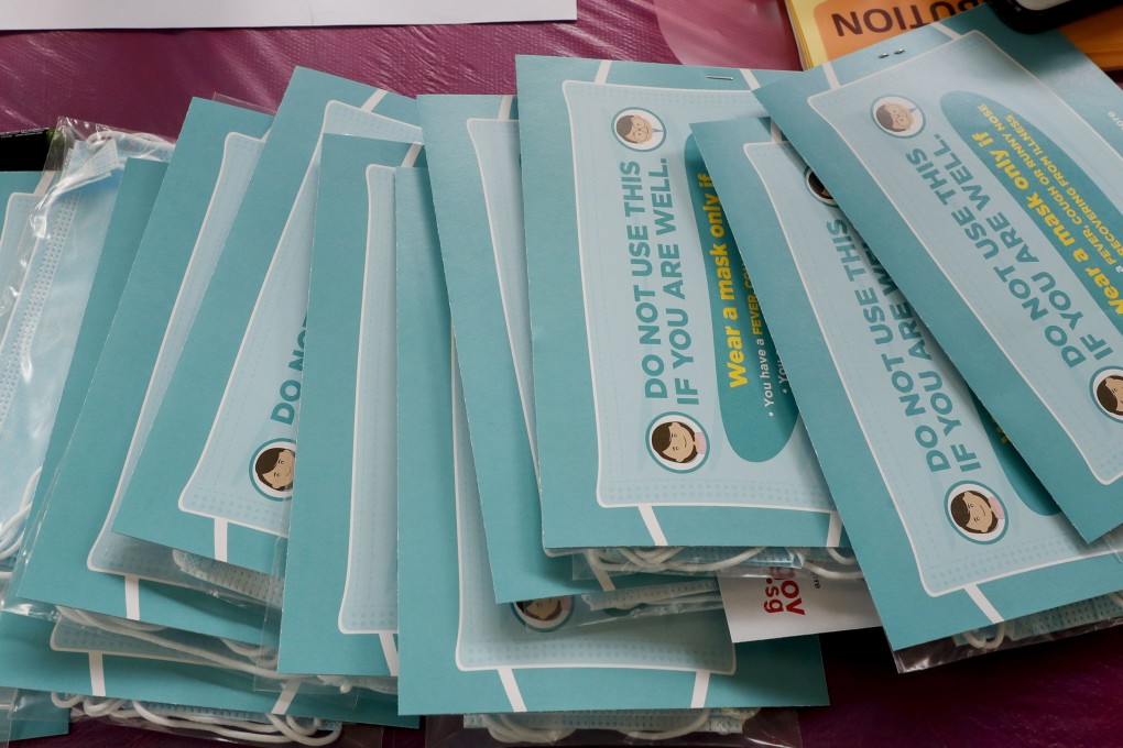 Packs of surgical masks on a table at a distribution point in Singapore, which now has 28 confirmed cases of the coronavirus. Photo: EPA