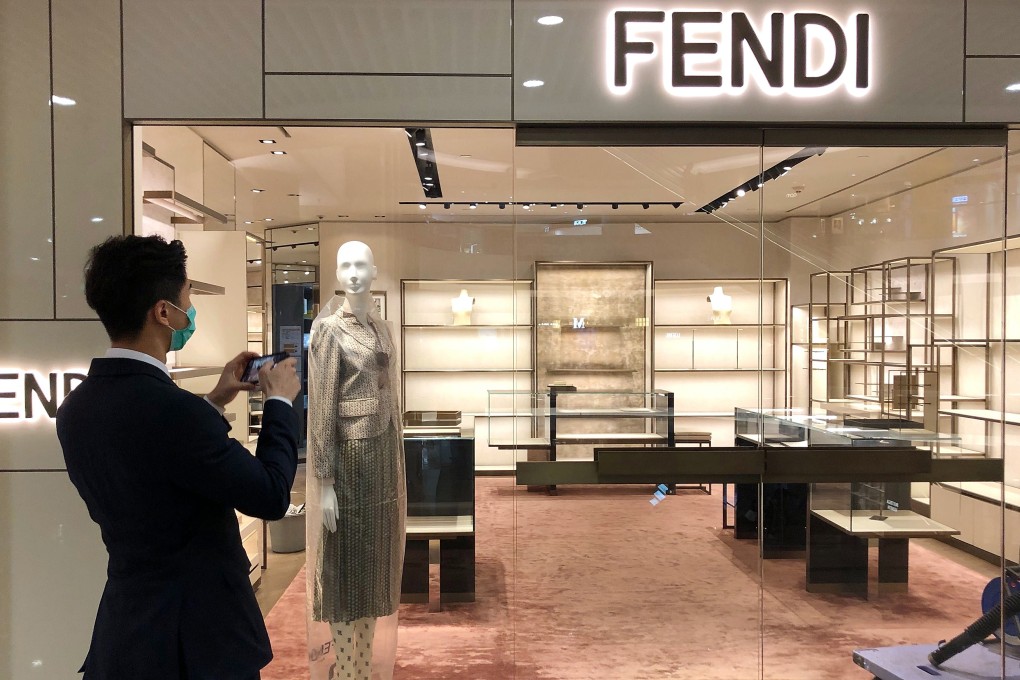 A man photographs an empty Fendi store at Times Square in Causeway Bay on Wednesday. Photo: Martin Chan