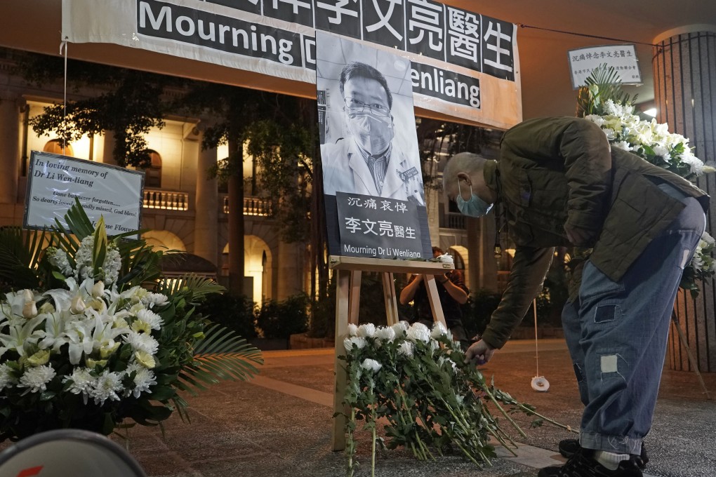 A man wearing mask attends a vigil for doctor Li Wenliang in Hong Kong. Photo: AP