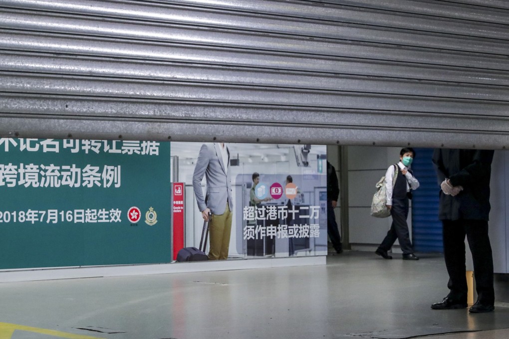The Lo Wu checkpoint between Hong Kong and mainland China is among border crossings now closed, while outbreak epicentre Wuhan is under a lockdown. Photo: Edmond So