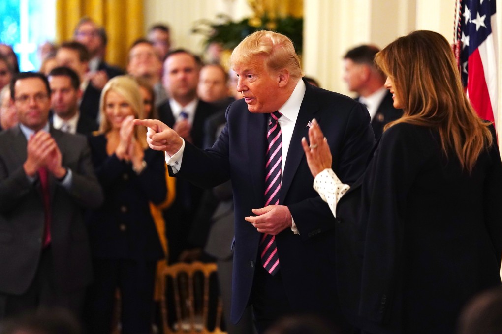 US President Donald Trump gestures as US First Lady Melania Trump waves. Photo: EPA-EFE