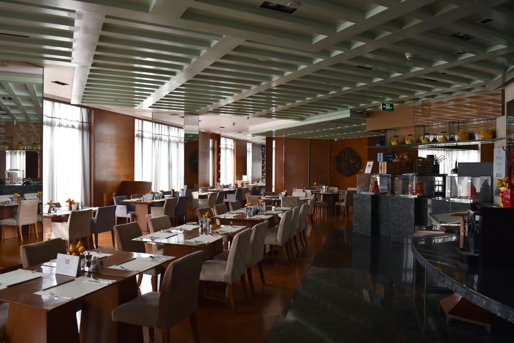 This hotel cafe is deserted as tourists stay away from mainland cities amid the coronavirus outbreak. Photo: AFP