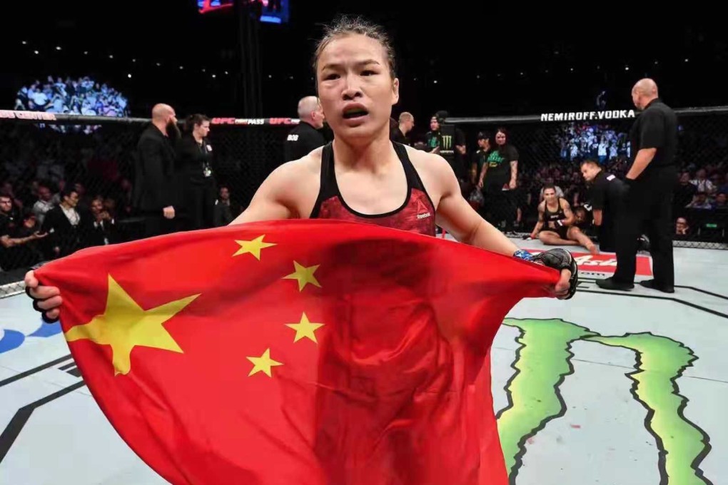 Zhang Weili celebrates with the Chinese flag after beating Jessica Andrade in Shenzhen. Photo: Brandon Magnus/Zuffa LLC