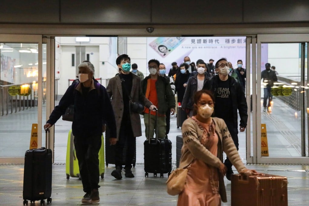 Tourists arrive in Hong Kong from Shenzhen a day before strict quarantine measures are due to come into force. Photo: K. Y. Cheng
