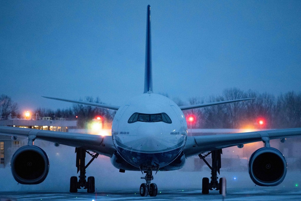 A plane carrying 176 Canadian citizens from Wuhan, China, arrives at CFB Trenton in Ontario on Friday. Photo: AFP