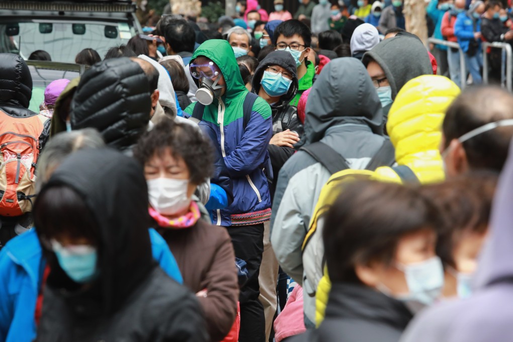 People queue up to buy face masks in Kowloon Bay on February 5, amid a shortage as the novel coronavirus hits Hong Kong. Photo: May Tse