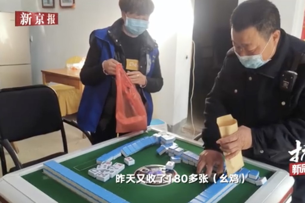 Police confiscate mahjong tiles as they enforce the order that people refrain from playing. Photo: Weibo