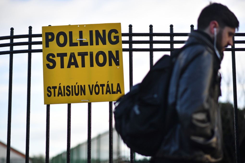 A man walks past a polling station in Dublin on Saturday. Photo: AFP