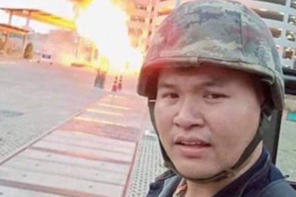 A photo circulated on social media shows the gunman wearing a green camouflaged military helmet while a fireball and black smoke rage behind him. Photo: Handout
