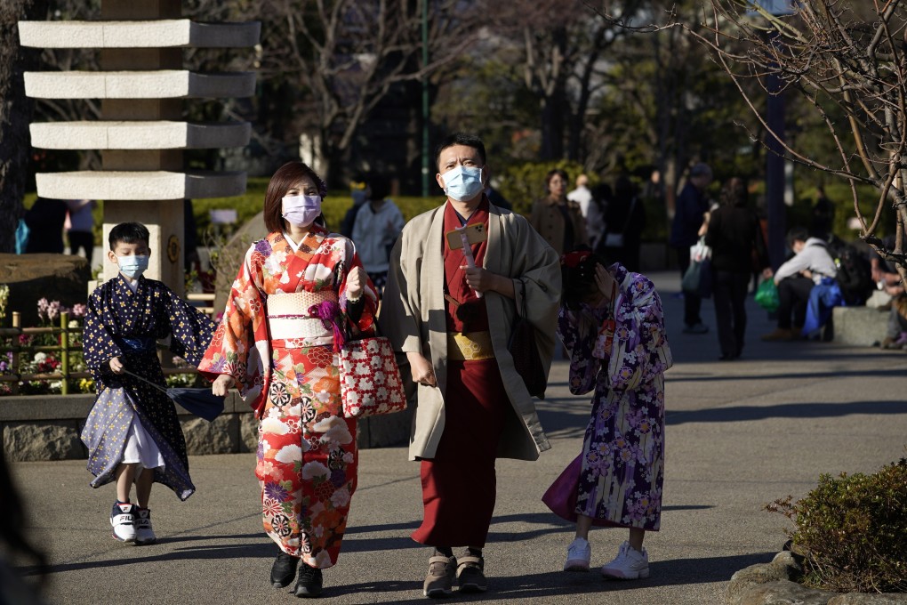 Tourists wearing masks visit the Sensoji temple in Tokyo, on January 30. Japan’s Prime Minister Shinzo Abe has said the Tokyo Olympic Games will go ahead despite novel coronavirus fears. Photo: EPA-EFE