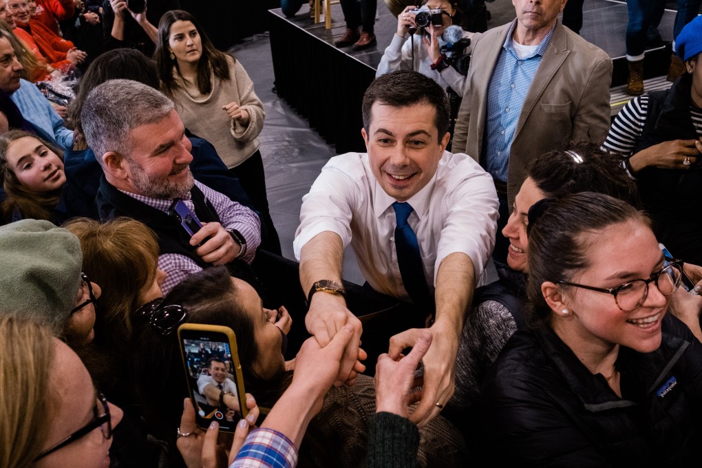 Pete Buttigieg, former mayor of South Bend and 2020 presidential candidate, centre, greets supporters in Lebanon, New Hampshire. Photo: Bloomberg