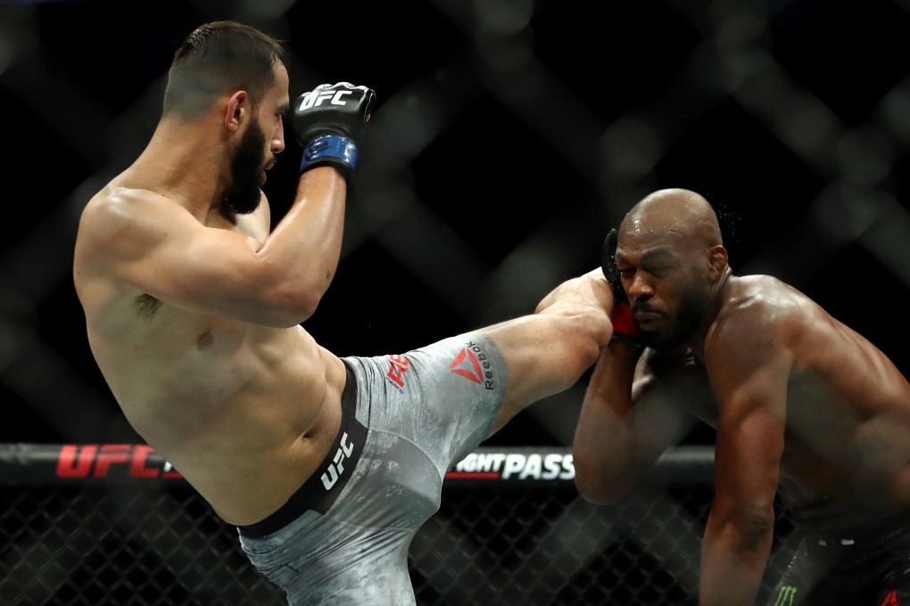 Dominick Reyes kicks Jon Jones at UFC 247. Photos: AFP