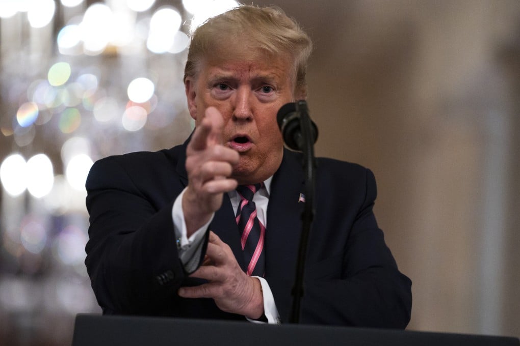 US President Donald Trump gestures as he speaks in the East Room of the White House on Thursday. Photo: AP