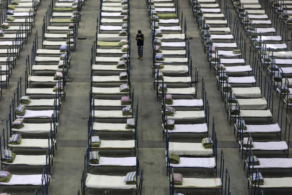 Beds in a convention centre that has been converted into a temporary hospital in Wuhan, central China's Hubei Province. Photo: AP