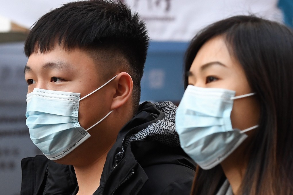 People wearing face masks in London. Photo: EPA