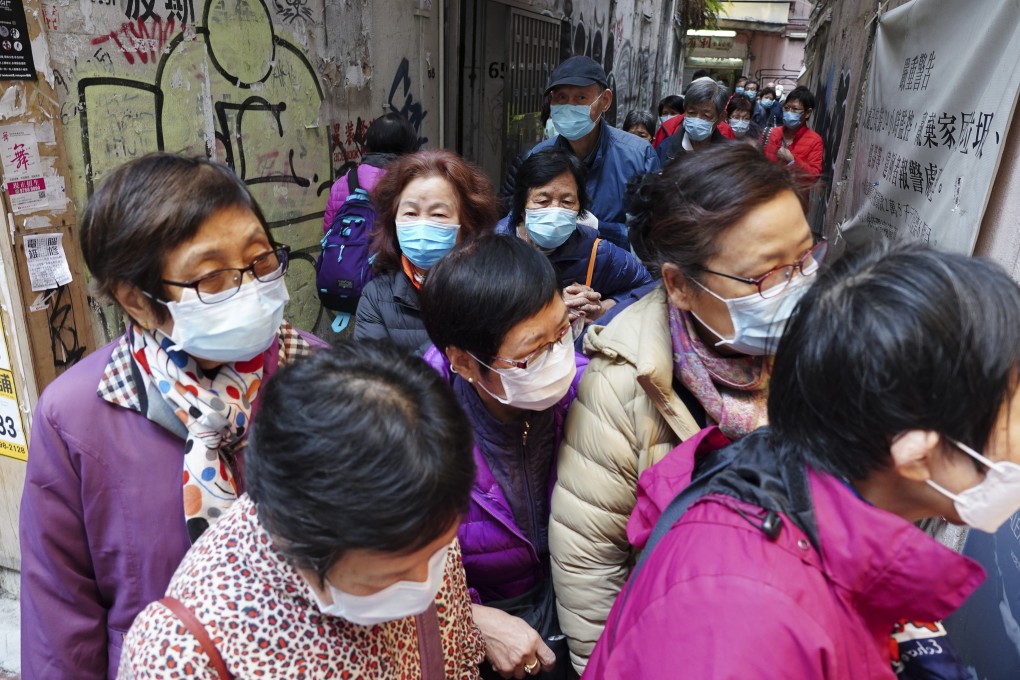 Private firms and retailers, including this watch and jewellery shop in Causeway Bay, have been giving away complimentary masks to the public. Photo: Robert Ng