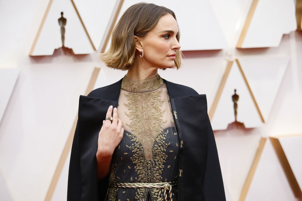 Natalie Portman wears a Dior gown embroidered with the names of women filmmakers to make a point about representation in the Academy Awards nominations. Photo: Jay L. Clendenin/Los Angeles Times/TNS
