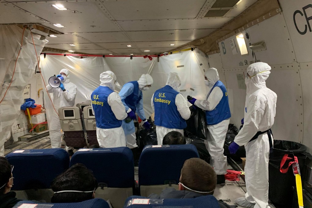 Staff from the US embassy board a cargo plane, chartered by the US State Department to evacuate Americans and Canadians from China due to the outbreak of novel Coronavirus, during the boarding process at Wuhan Tianhe International Airport in Wuhan on February 7, 2020. Photo: Reuters
