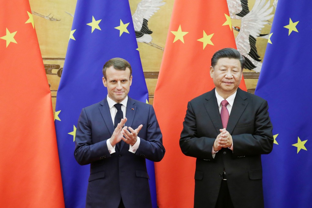 Chinese President Xi Jinping and French President Emmanuel Macron stand in front of Chinese and European Union flags at a signing ceremony in the Great Hall of the People in Beijing on November 6, 2019. Photo: Reuters