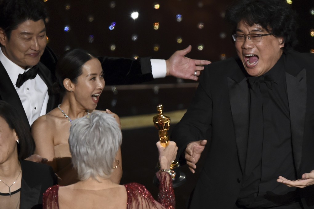 Bong Joon-ho reacts as he is presented with the Oscar for best picture for Parasite by actress Jane Fonda at the Academy Awards ceremony at the Dolby Theatre in Los Angeles. Looking on from left is the film’s star Song Kang-ho. Photo: AP