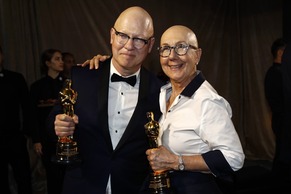 Julia Reichert and Jeff Reichert pose with the Oscar for best documentary feature for American Factory at the Governors Ball following the Academy Awards in Los Angeles. The film is about a Chinese company taking over a former US car plant and how two workplace cultures mesh together. Photo: Reuters