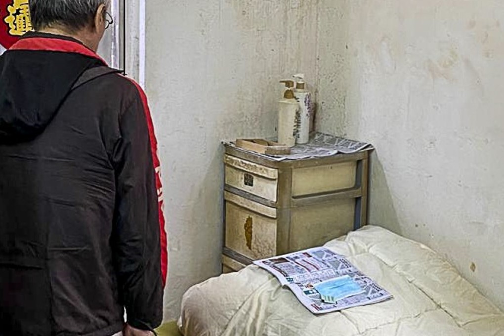 An elderly low-income resident uses newspaper to store his used mask, hoping it can absorb some of the moisture before reuse. Photo: Kwai Chung Subdivided Flats Residents’ Alliance