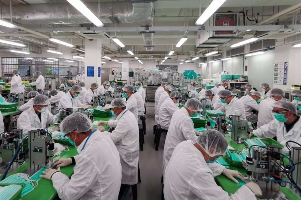 Volunteer officers from the Correctional Services Department produce masks at Lo Wu on February 7, 2020. Photo: Handout